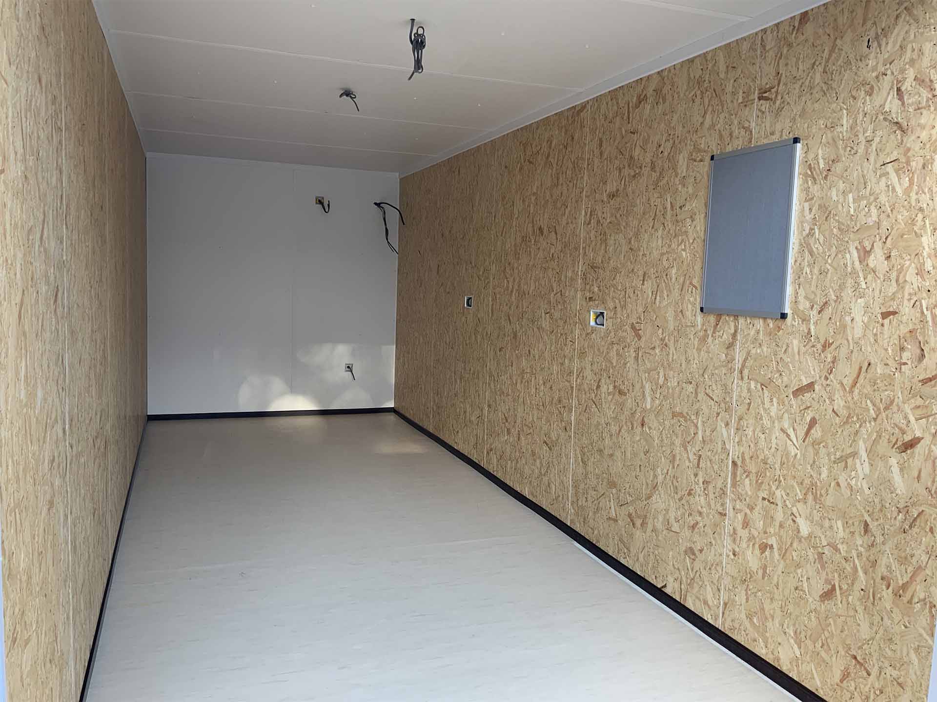 Lined and powered interior of a 20ft × 8ft VOLT VAULT storage unit